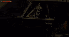 a man wearing sunglasses and a hat is standing next to a car with the words bruno mars on the bottom right