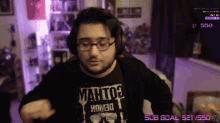 a man wearing a shirt that says mahto3