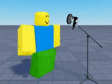 a roblox character is sitting in front of a microphone and smiling