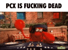 a sesame street character is playing music on a dj mixer