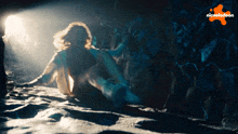 a nickelodeon ad shows a woman laying in the dark