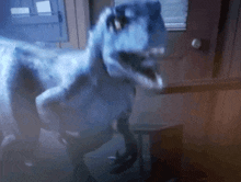 a t-rex dinosaur is standing in a room with its mouth open .