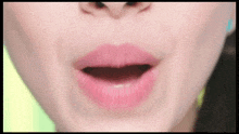 a close up of a woman 's mouth with her mouth open