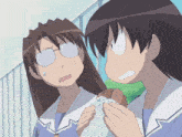 a couple of anime characters standing next to each other with one holding something