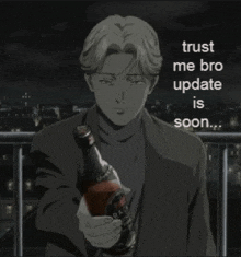 a man in a suit is holding a bottle of beer in his hand .