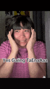 a woman in a pink shirt is making a funny face with the words yes galing taenaaa written below her