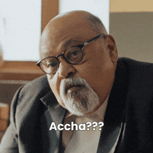 a bald man with glasses and a beard says accha??