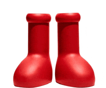 a pair of red bottles that look like boots on a white background