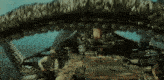 a man sits on a boat with a giant snake coming out of it 's mouth