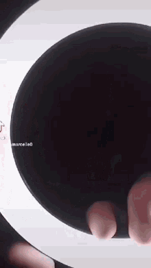 a person 's feet sticking out of a hole in a black circle