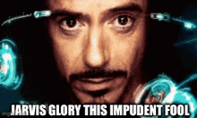 a close up of a man 's face with the words `` jarvis glory this impudent fool '' .
