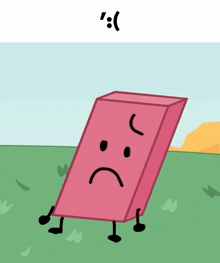 a pink block with a sad face is standing in a grassy field