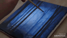 a painting is being painted on a canvas with the words made in animotica on the bottom