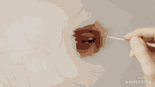 a painting of a woman 's face is being made by animatica