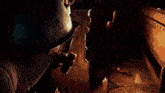 a close up of a person 's face with a light coming out of it .