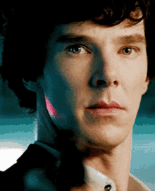 a close up of a man 's face with a serious expression
