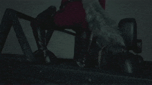 a woman in a santa suit is sitting in a car