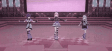 three anime characters are dancing on a stage in front of a large screen