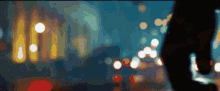 a blurry image of a person walking down a street