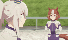 a girl with a horse on her head stands next to a girl with a ponytail