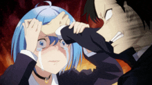 a girl with blue hair is crying while a man holds her hand to her head