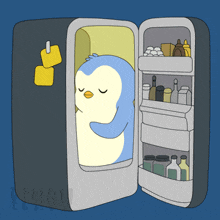 a penguin is sleeping in a refrigerator with the word penguin on the bottom