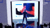 a man is standing in front of a screen that says u-s-a