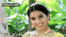 a woman is smiling in front of a tree and says anand a name like a good coffee