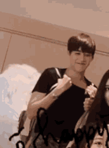 a man and a woman are standing next to each other .