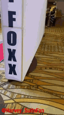 a sign that says foxx on it in black