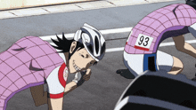a person wearing a helmet with the number 93 on it