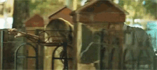 a blurred image of a playground with a giraffe playing on it