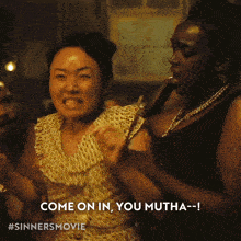 two women are dancing and one of them says come on in you mutha-- !
