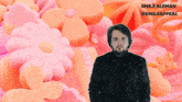 a man with a beard is standing in front of a pink and orange background with the name emile aleman