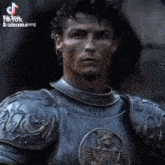 a close up of a man wearing armor with a tiktok watermark