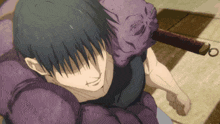 a man with a purple object on his head is holding a sword