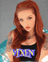 a woman with red hair is standing in front of a poster that says vixen