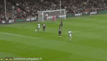 a soccer game is being played on a field with advertisements for unibet in the background