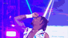 a pixelated image of a wrestler with a purple background and the letters rsl live on the bottom