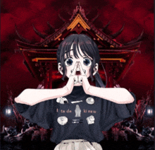 a girl is wearing a black shirt that says i ta de ki meu