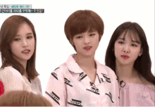 three girls are standing next to each other with one wearing a shirt that says twice