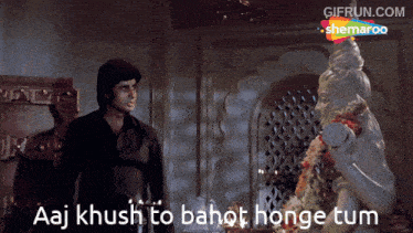 a man standing in front of a statue with the words aaj khush to bahot honge tum below him