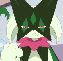 a cartoon drawing of a cat with a green and white face