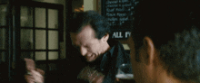 a man says drink up let 's boo-boo in front of a menu