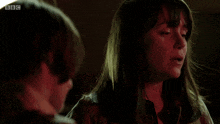 a woman is talking to a boy with the words " and what else do you remember about him "