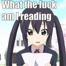 a girl with pigtails is holding a piece of paper with the words `` what the fuck am i reading '' .