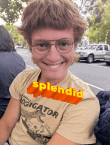 a young man wearing glasses and a t-shirt that says ' splendid ' on it