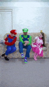 mario luigi and princess peach are sitting on a couch