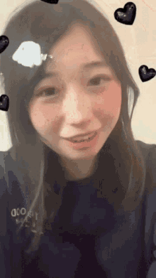 a girl wearing a blue sweater that says discovery on it