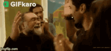 a group of people are standing around a man with glasses .